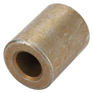 A cylindrical bronze bushing with a hollow center, viewed at an angle, identified as the AGCO SPACER - ACY1544410 from the brand AGCO. Currently, no additional product description information is available.