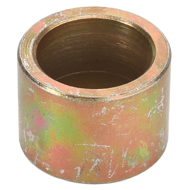 A cylindrical, metallic bushing with a weathered, multi-colored surface. Product Name: AGCO | Bush - Fel151081 by AGCO. No current product description available.