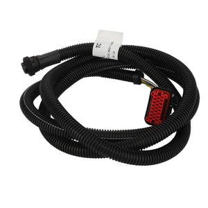 A coiled harness in black from AGCO, featuring multiple connectors — including a striking red one — and labeled "Harness - Acw150403A" with a white tag attached to the wires.