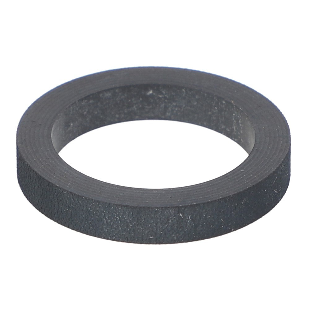 The AGCO Reducer Bush - Ag056275 is a black, round washer featuring a flat, textured surface and a central hole. No current product description available.