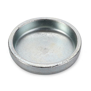 The AGCO Cup Plug - 3383244M1 is a small, round, shallow metal dish with a plain surface and raised edges, ideal for holding small parts when working on your 4WD or 2WD vehicle.