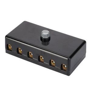 No current product description available for the AGCO Fuse-Box - F231901040010, a rectangular black electrical connector block featuring six brass terminals and one central adjustment screw on the top.