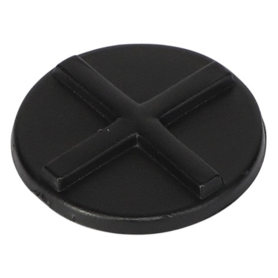 A round, black plastic object with a raised X-shaped design on top, reminiscent of the sturdy components found in AGCO Padding - 4389714M1 by AGCO.