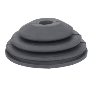 The AGCO | BELLOWS - F716974160020 is a sleek black rubber grommet that features a layered, conical shape with a central hole for versatile applications.