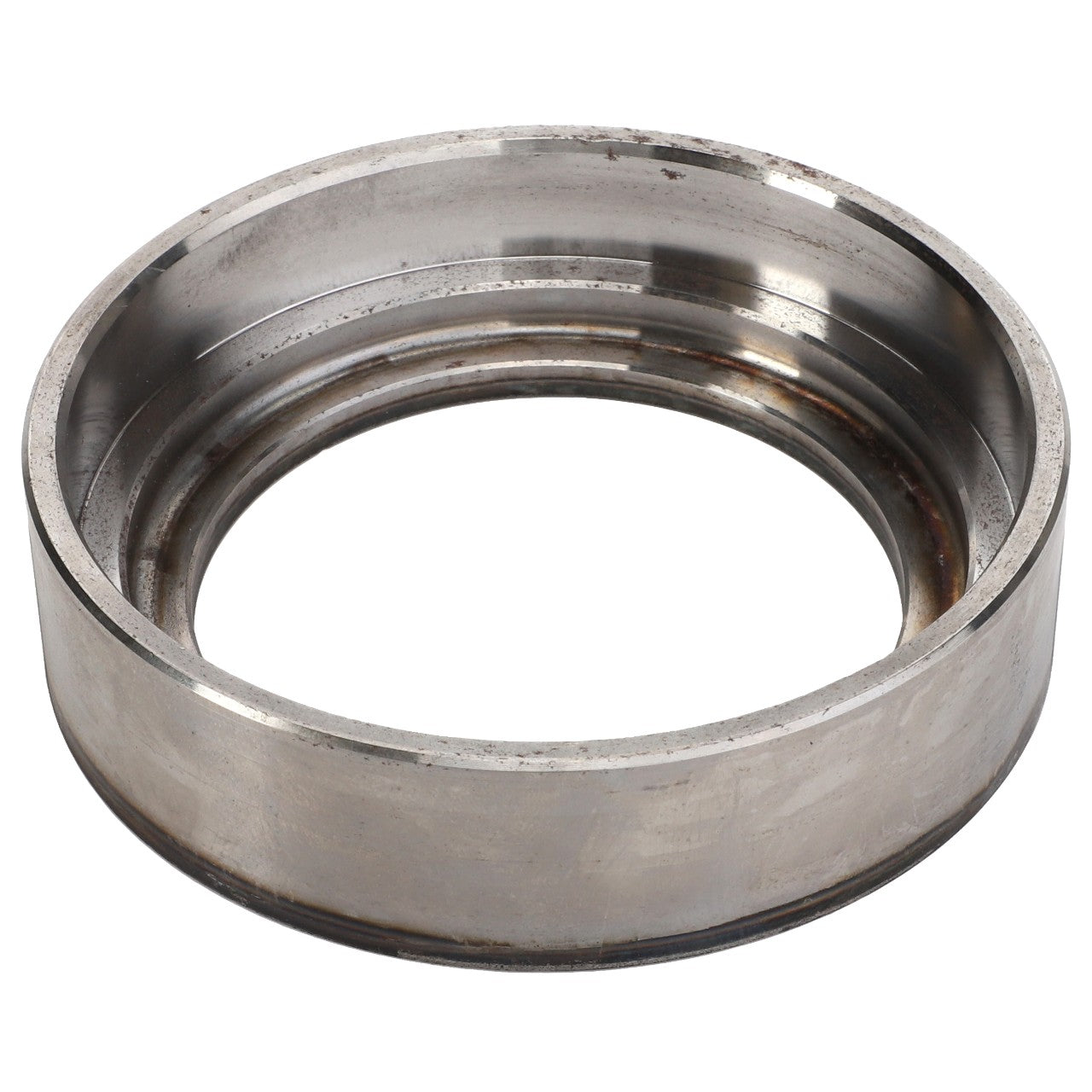 Close-up of the AGCO | Bearing - Acp0500460, a silver metal ring with inner and outer grooves, exhibiting a slightly weathered surface. No current product description available.