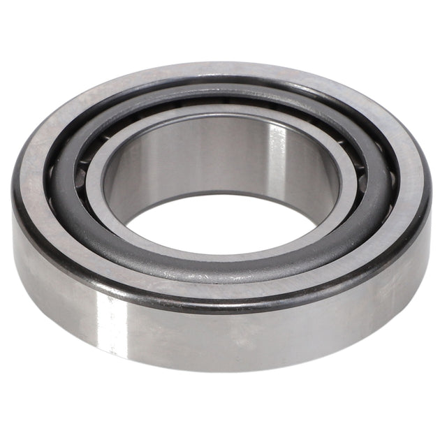 The AGCO | Roller Bearing - F385103220030 from AGCO is a metallic cylindrical roller bearing featuring an inner and outer ring, meticulously crafted to reduce friction between moving parts in machinery.