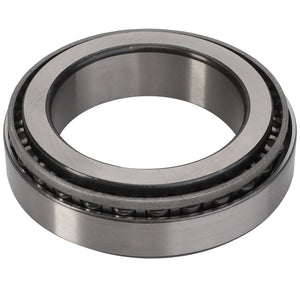 The AGCO Taper Roller Bearing - Acp0644110, featuring an inner and outer ring with cylindrical and radial grooves containing rolling elements, is adept at handling thrust loads in various Fendt models.