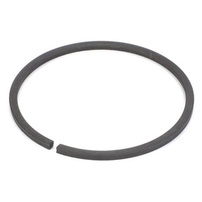 The AGCO Circlip - 4301527M1 is a black, circular metal piston ring with a small gap, specifically designed for use in internal combustion engines and compatible with Massey Ferguson and Fendt models.