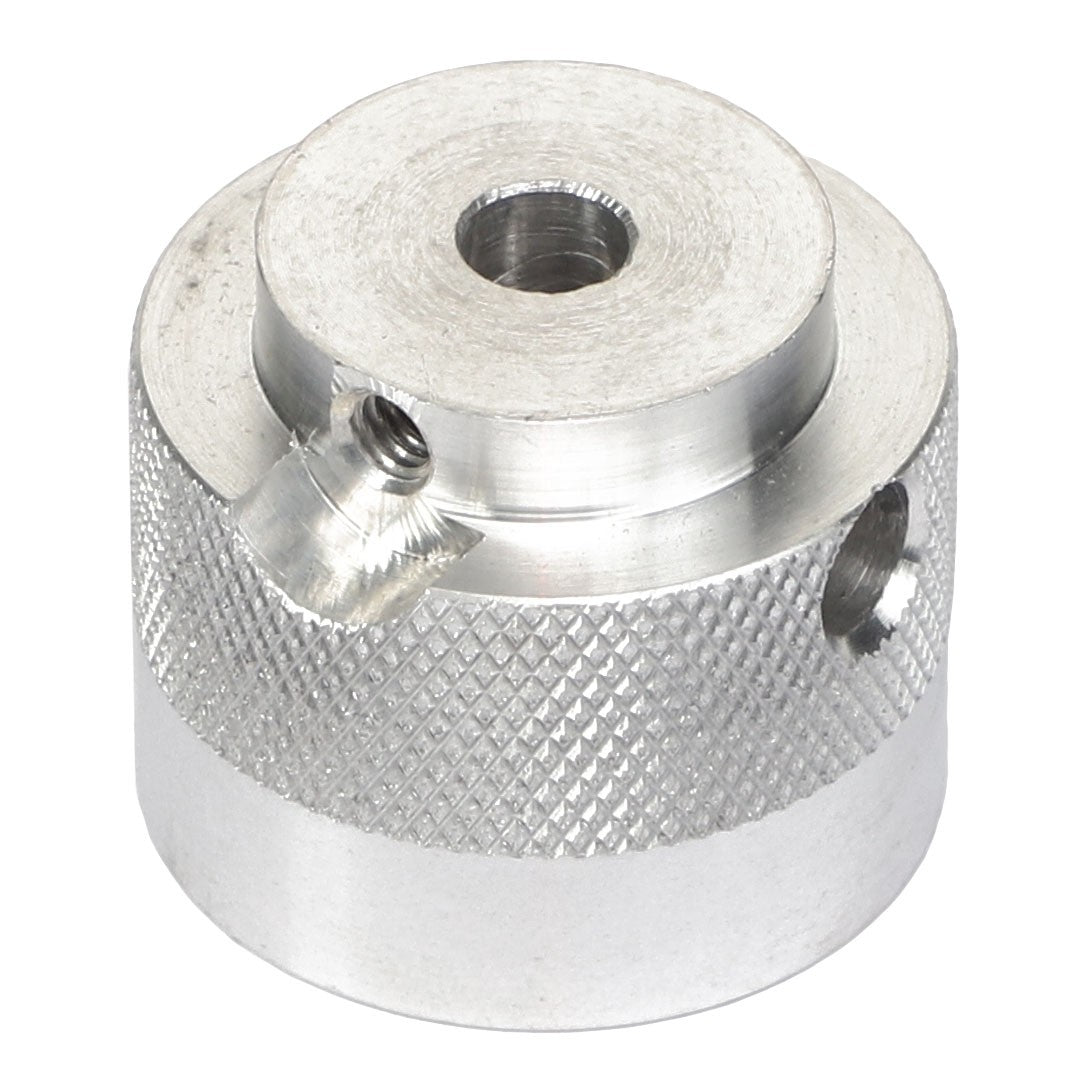 The AGCO | COUPLER - AG716993 is a cylindrical silver metal component with a knurled texture, featuring a central hole and two side holes for secure fastening.