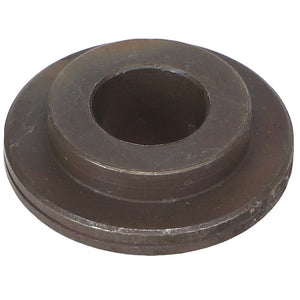 A circular, dark metal washer with a central hole and a slightly raised outer rim from AGCO, known as the AGCO Bush - Acw2425810. Unfortunately, no current product description information is available.