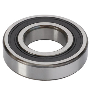 A close-up image of a single AGCO Roller Bearing - La28996540, featuring black inner and outer rings, designed to minimize rotational friction and efficiently handle radial and axial loads.