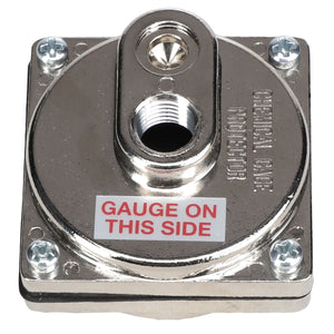 Close-up of the AGCO GAUGE PROTECTOR - AG515414, a square, metallic device with a central threaded hole. Labeled "GAUGE ON THIS SIDE," it features four screws at each corner. No current product description information available.