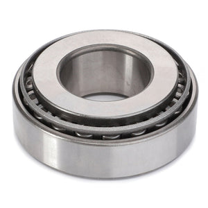 The AGCO Taper Roller Bearing - F199300020180, featuring a metallic outer ring and multiple cylindrical rollers, is ideal for managing thrust loads and is displayed on a plain white background.