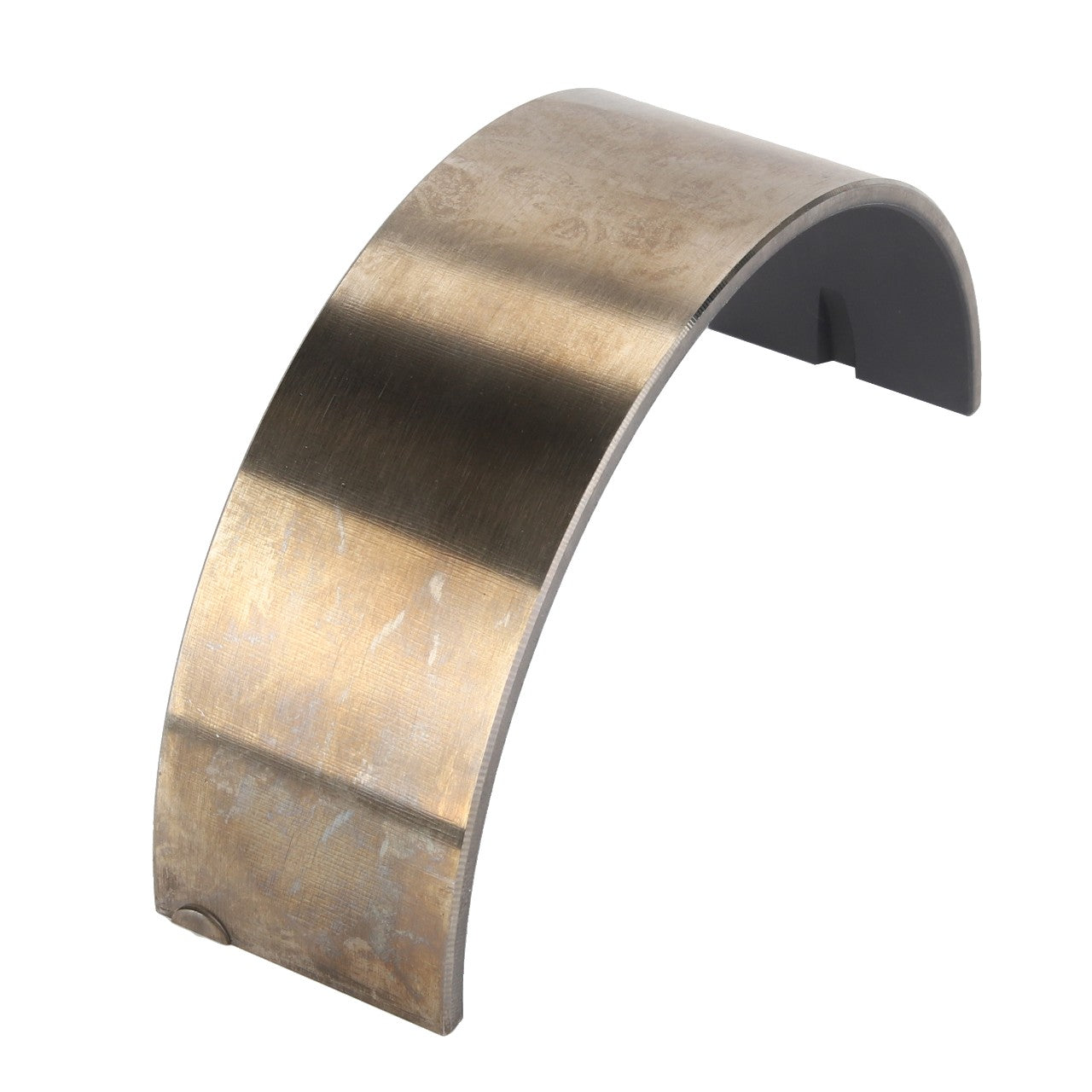 The AGCO | Bearing Shell - Acp0584530 is a curved, metallic piece with a smooth surface and a flat base, engineered for precision in automotive or mechanical applications.