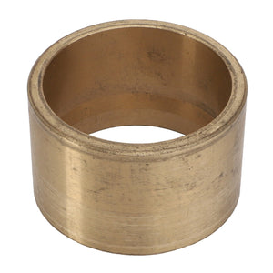 A cylindrical brass bushing with a hollow center and a slightly worn surface, designed for use in mechanical and automotive applications. Currently, no further product description information is available for AGCO | LINING - D28780810 by AGCO.