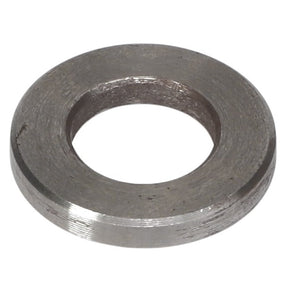 A close-up image of the AGCO | CHANGE VALVE - F842960200020 washer, showcasing its smooth, circular shape and a large central hole. The slightly rough texture of the metal washer is prominently displayed. Please note: No current product description information is available.