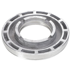 Close-up of the AGCO | CLUTCH PISTON - AG331585, a silver metallic mechanical part featuring a circular design with multiple grooves and slots around its circumference.