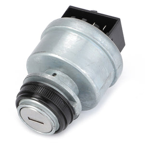 The AGCO Ignition Switch - 4295836M2 features a round metal key switch and a rectangular black base, specifically designed for integration into electrical or mechanical systems, and is frequently used in Massey Ferguson models.