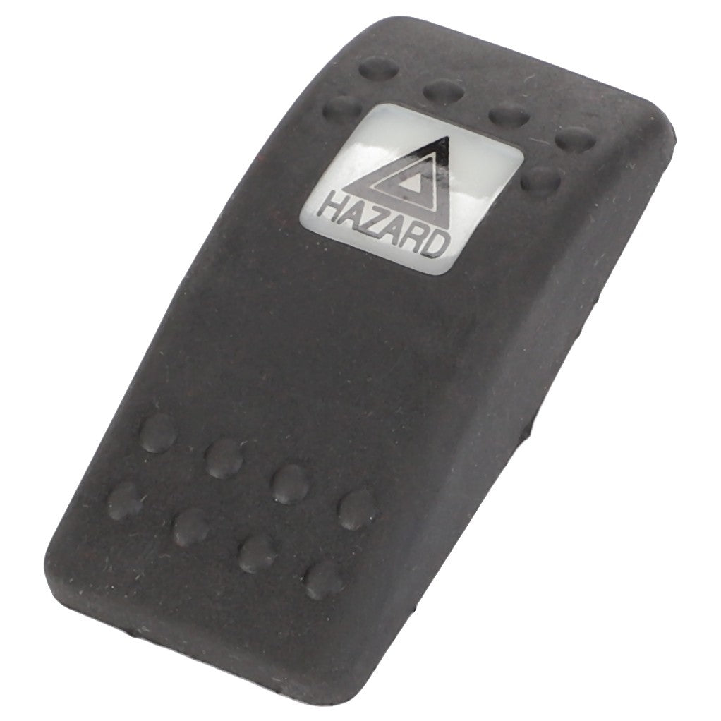 A black rubber footswitch cover labeled "Warning" with a triangular warning symbol, ensuring safety and durability. The product is AGCO's WARNING SWITCH - D45050052.