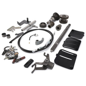 The AGCO | Pto Kit - Acw1401580, featuring an assortment of mechanical components such as gears, cables, brackets, and hardware from the renowned brand AGCO, is meticulously arranged on a white background.