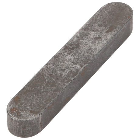 The AGCO Parallel Key - 3006635X1 is a metal rectangular bar with rounded edges, featuring a tarnished and slightly textured surface.