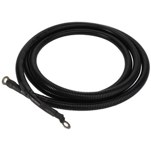 The AGCO | BATTERY CABLE - ACY1178890, a coiled, black, corrugated plastic conduit with eyelet connectors at both ends, lies against a stark white background.