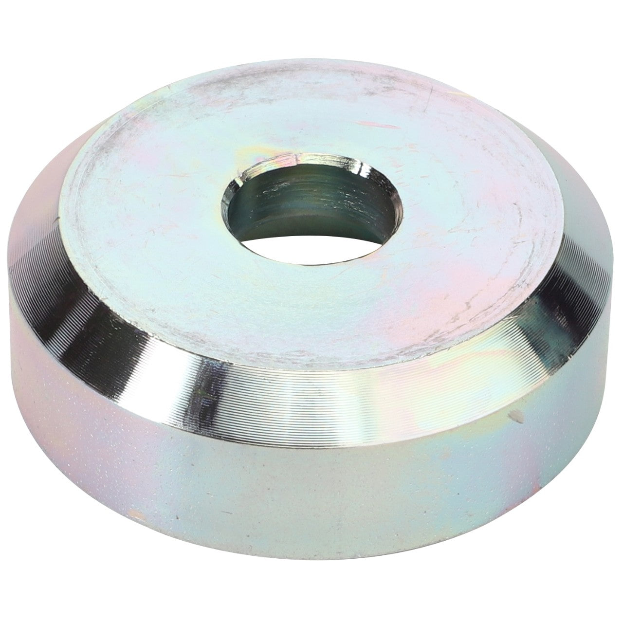 The AGCO Thrust Washer - Fel151183 is a metallic, circular object with a central hole and angled edges. Its surface features a reflective finish with slight color variations.