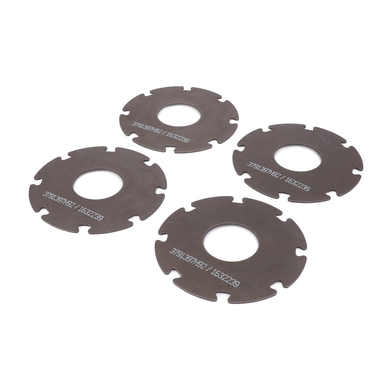 Four metal circular disc parts with central holes and notched edges are arranged on a white background, perfect for the AGCO Washer Kit - 3791397M92 that fits Valtra and Massey Ferguson.