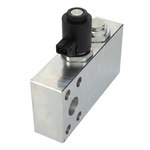 The AGCO Hydraulic Block - Acw9550010 by AGCO is a precisely engineered metal hydraulic valve block, featuring various ports and a robust black solenoid mounted on top.