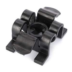 The AGCO | Cap - 916500020360 is a black plastic cable clip with three slots, designed to hold and organize cables, making it perfect for use in Massey Ferguson or Favorit Vario setups.