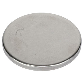 The AGCO Plug - AG334581 by AGCO is a flat, round, metal disc featuring a smooth surface with no visible markings. Detailed product description information is currently unavailable.