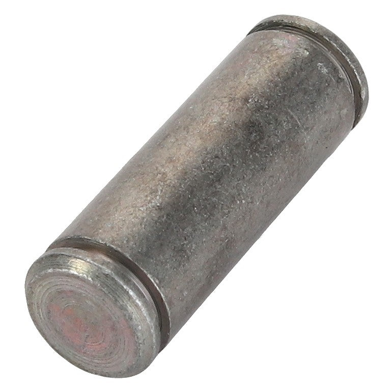 A close-up of the AGCO BOLT - F716501030760, a cylindrical metal pin or dowel, slightly weathered and rough-textured, evocative of components found in classic Fendt models.