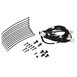 A bundle of AGCO wire harnesses (F931502031100) with connectors, several black zip ties, and an assortment of screws and blue rubber grommets arranged on a white surface. Please note that there is no current product description information available.