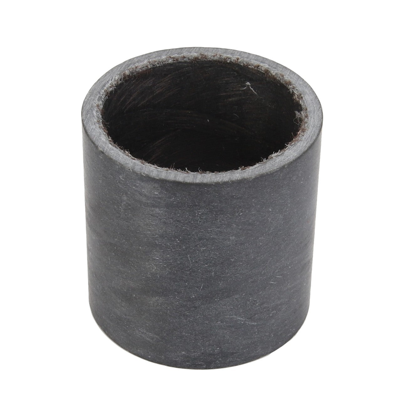 The AGCO Bush - Acw1125770 is a cylindrical, black rubber bushing with a hollow center, presented from an angle that highlights its circular opening.