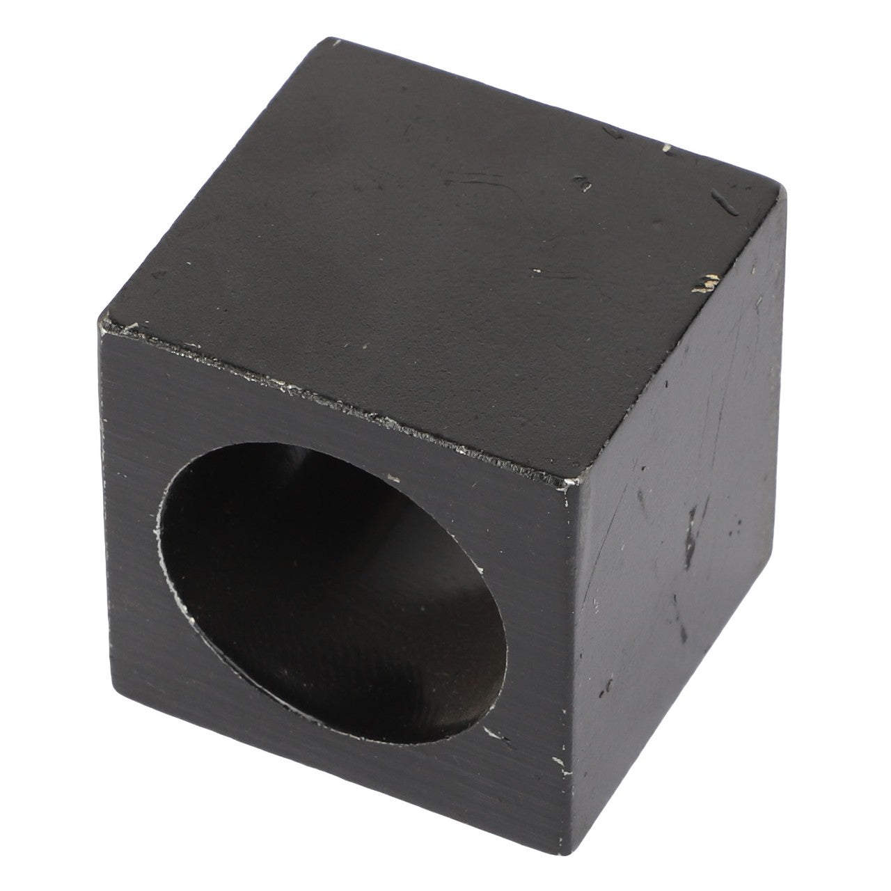 A black cubic object with a cylindrical hole passing through its center; currently, no product description information is available for the AGCO | SLEEVE - AL330214 by AGCO.