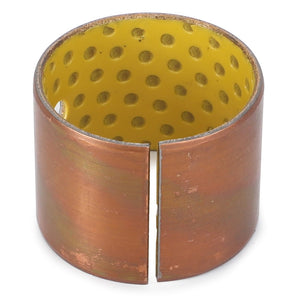 The AGCO | BUSH - AL5018517 from AGCO is a cylindrical, copper-colored original bushing featuring a yellow, perforated interior and a visible side slit designed for front loaders.