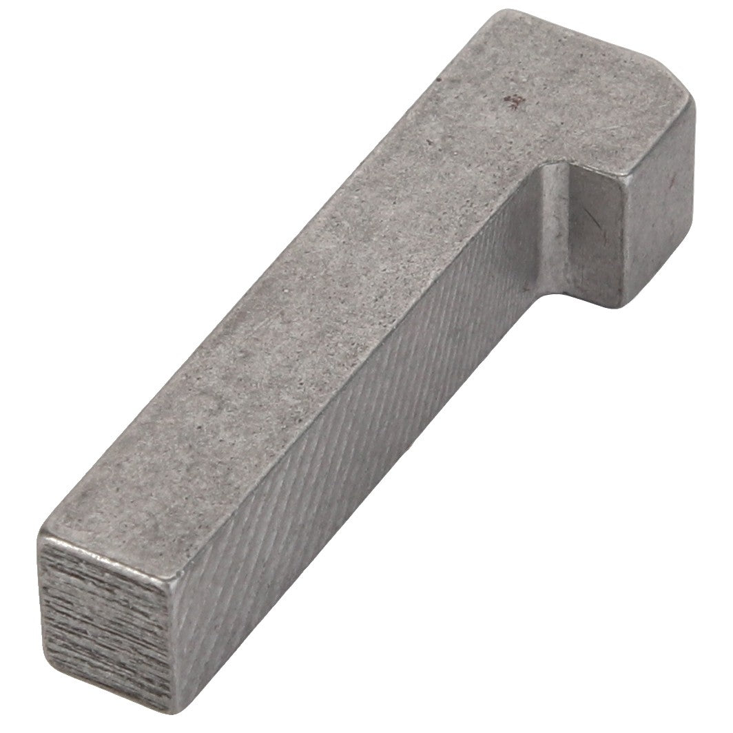 The AGCO GIB KEY - D26732728 is a metallic rectangular tool featuring a slight angle near one end, appearing to be made of steel or a similar metal.