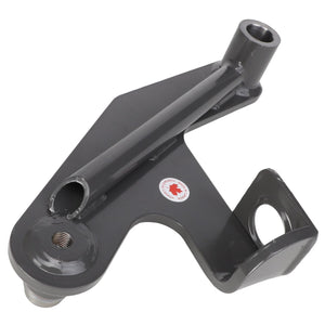 The AGCO | Idler Arm - Acw550859A is a gray metal bracket featuring three distinct attachment points, including a pivot bracket and a cylindrical section. A sticker with a red maple leaf is visible on its surface. No current product description information is available from AGCO.