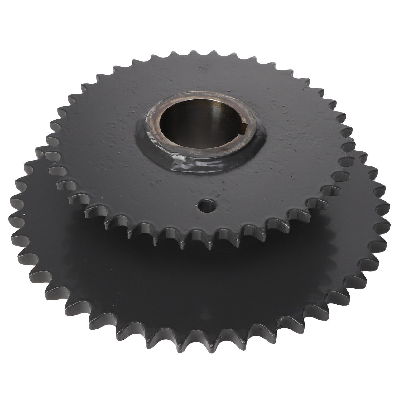 Two AGCO Sprocket - Acx2432710 gears, featuring interlocking teeth, are stacked on top of each other, showcasing their circular shape and central holes.