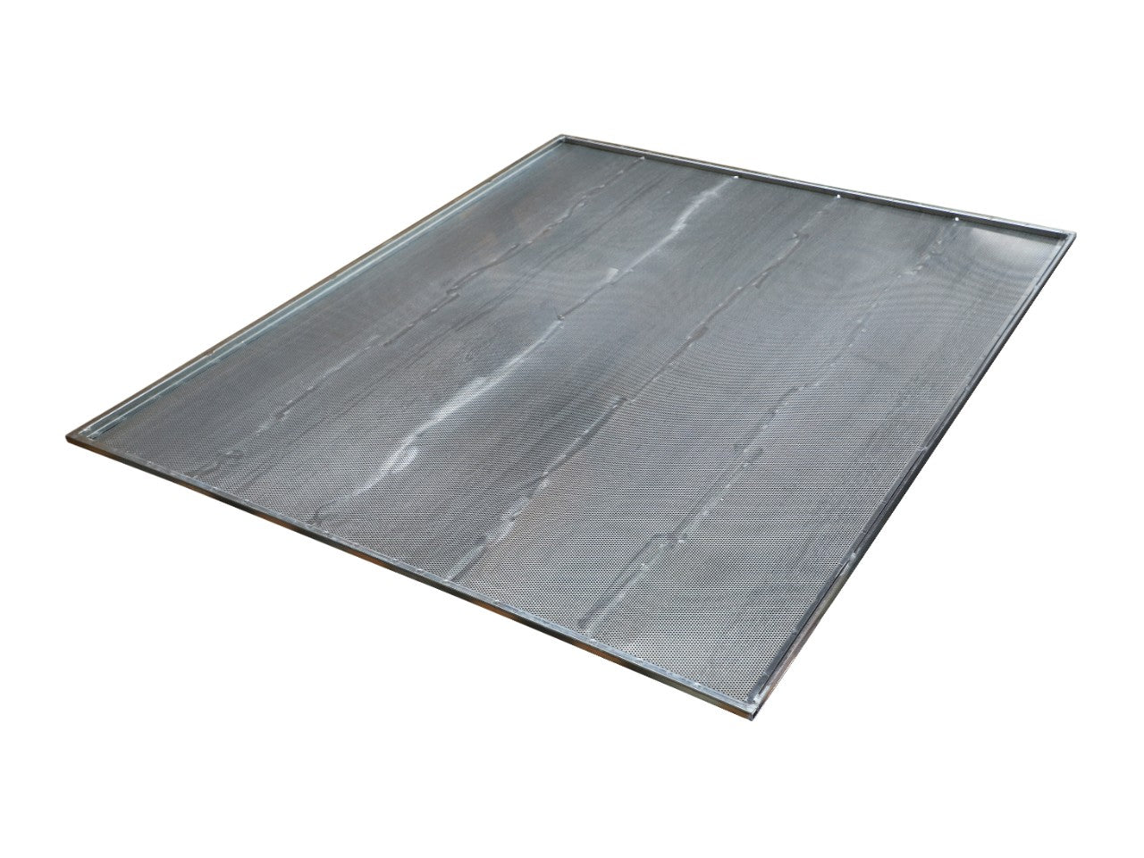 The AGCO Sieve - La320959650 is a metal baking sheet with raised edges, shown angled slightly above the surface. The sheet has a smooth, reflective finish. No current product description available.