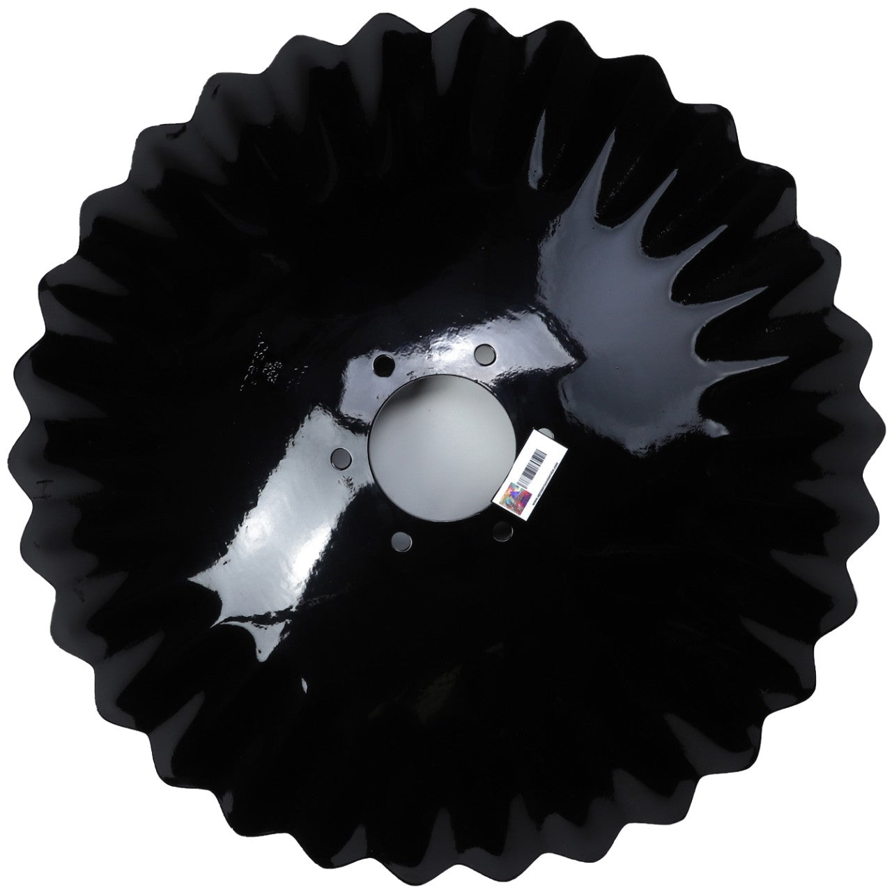 The AGCO Disc Blade - ACP0136620 is a black metal scalloped disc blade featuring a central hole and three smaller holes around it. For ordering assistance or inquiries, please contact our support team.