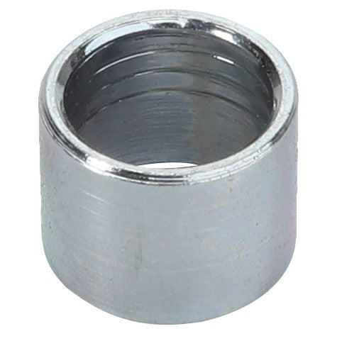 A cylindrical metal spacer with a hollow center and a smooth, reflective surface, known as the AGCO Spacer - Acw0388290 by the brand AGCO.