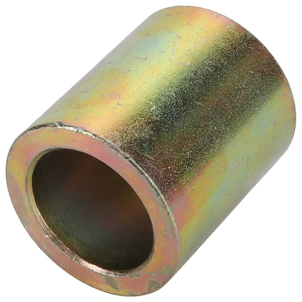 The AGCO Spacer - 6209926M1 is a metallic cylindrical bushing with an open center, featuring a slightly rough and textured surface and a yellowish tone. No current product description is available for additional specifications.