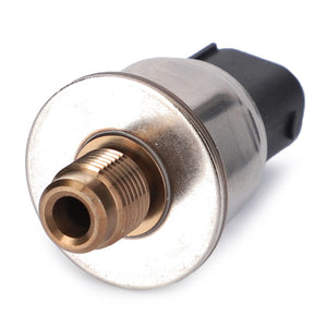 A close-up image of the AGCO | Pressure Transducer Wet Clutch With Power Shuttle - 4301086M1, featuring a brass and black electrical pressure sensor with a threaded connection and plastic connector, compatible with Valtra models.