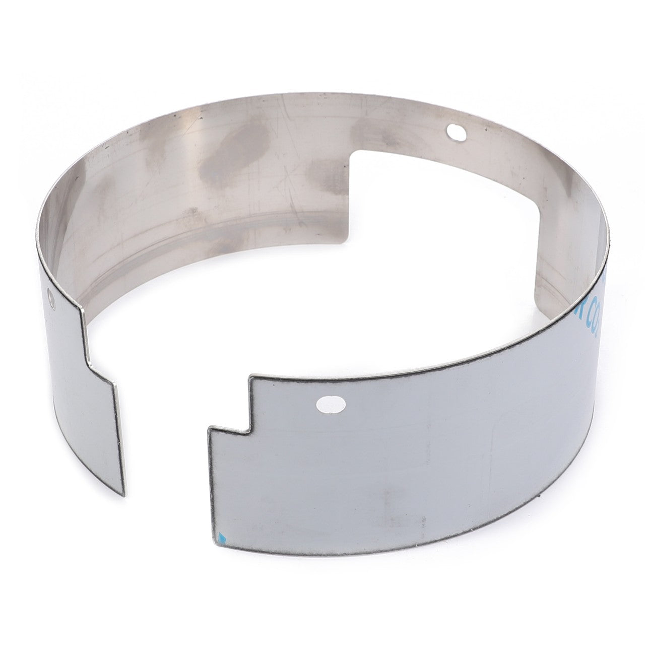 The AGCO Cover Panel - 737200102160 is a metallic cylindrical ring featuring notches and a circular hole, designed for industrial or mechanical applications and compatible with machinery brands like Valtra and Massey Ferguson.