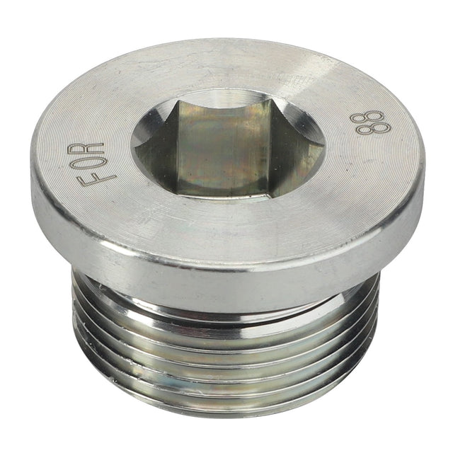 Close-up of a metallic threaded AGCO Port Plug - Acw2095930 with a hexagonal socket at the center. The plug features the word "FOR" and the number "88" etched onto its surface. No current product description information is available for this AGCO product.