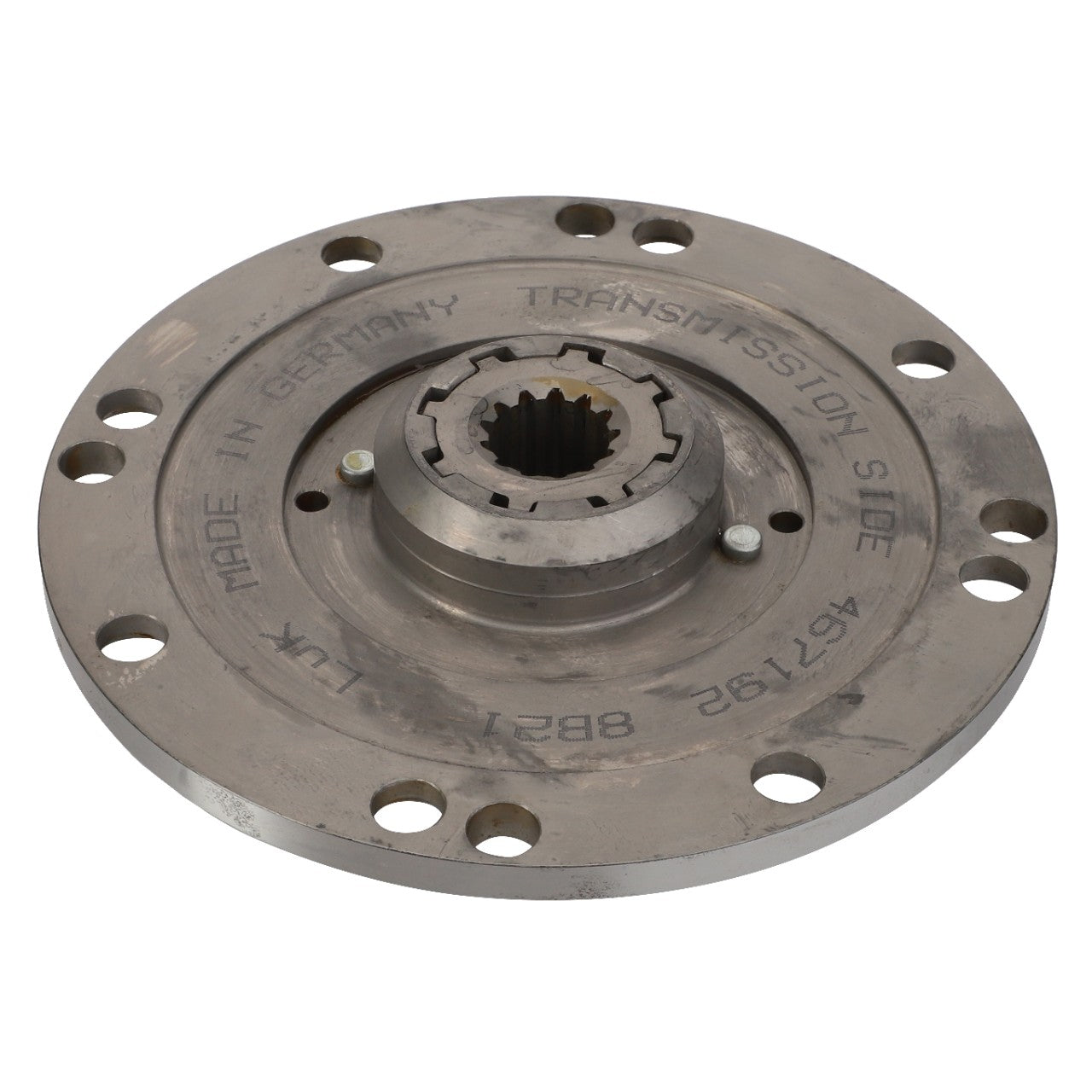 Circular metallic component labeled "Made in Germany" and "Transmission Side" with bolt holes around the perimeter and a central spline, identified as AGCO | Damper - Acp0333090 by AGCO. *No Current Product Description Available.*