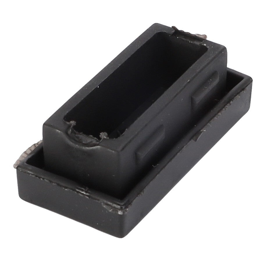 The AGCO Plug - 4384103M1, a plastic rectangular component featuring an open slot and small side tabs, is designed to fit Massey Ferguson models, including those equipped with Dyna-6 transmissions. It perfectly aligns with Massey Ferguson Fitment Information for ease of installation.