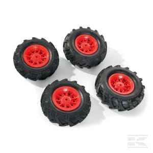 On a white background, four black toy truck tires with red hubs are arranged. This 4-piece set, the Pneumatic wheel set (310x95/325x110) red - R40958 from Rolly Toys, features striking red toy wheels that make it perfect for any young vehicle enthusiast.