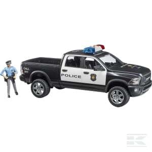 A Bruder RAM 2500 police truck (U02505) painted in black and white, featuring working light and sound effects, comes with a model police officer figure standing beside it.